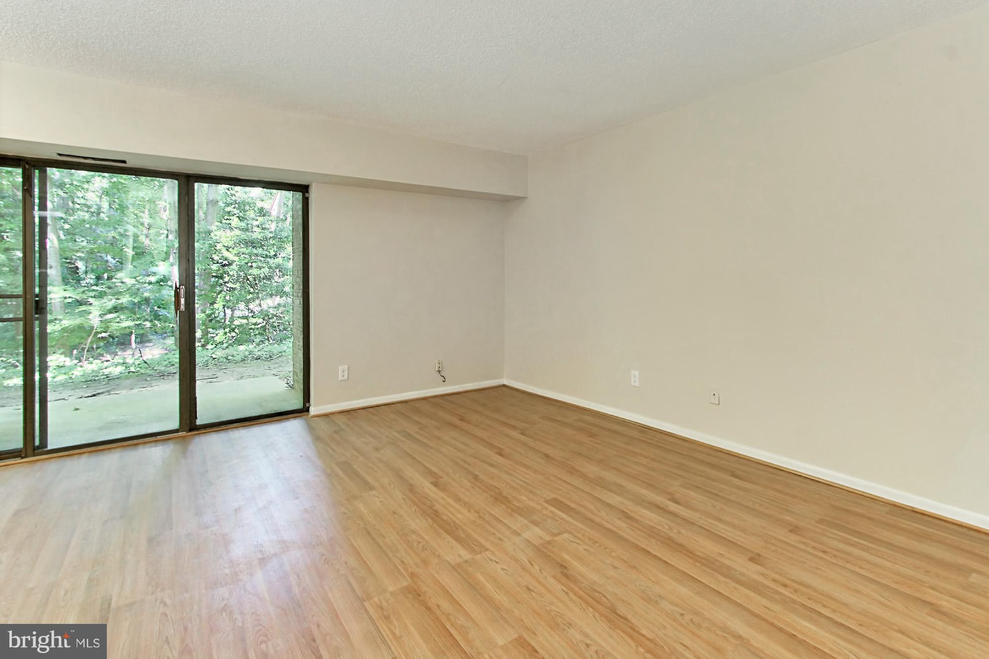11625 Stoneview Square, Unit 2B Reston, VA 20191 - Photo 8 of 30 Living Room with Great View of Trees