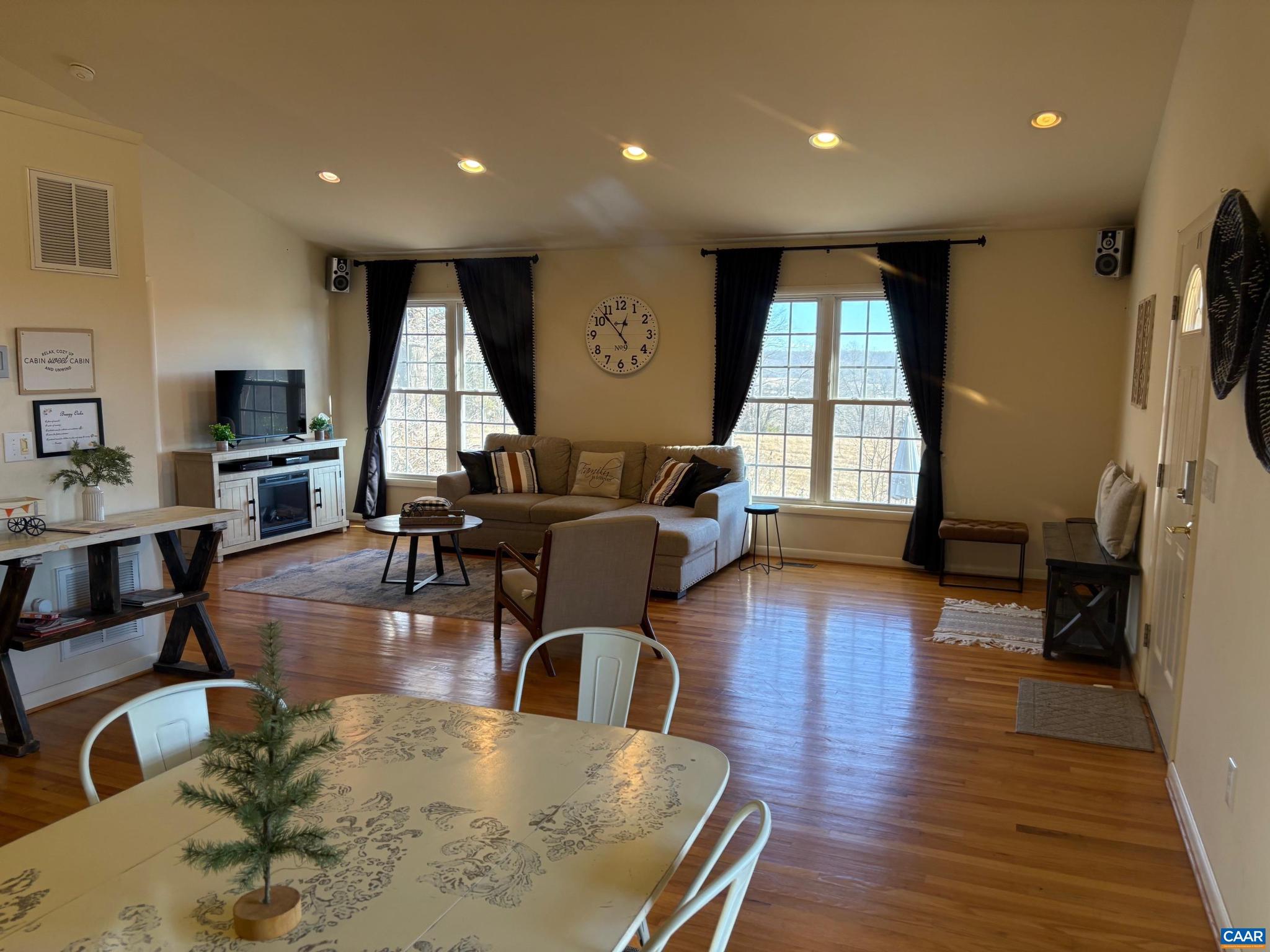 5305 West Hoover Road Reva, VA 22735 - Photo 3 of 9 a living room with fireplace furniture wooden floor and a large window