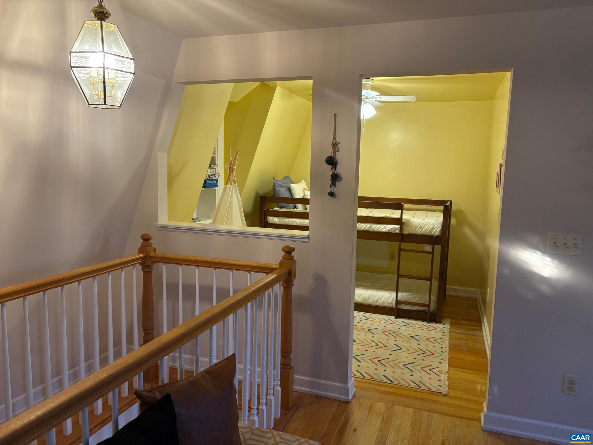 5305 West Hoover Road Reva, VA 22735 - Photo 6 of 9 a view of a hallway with wooden floor and staircase