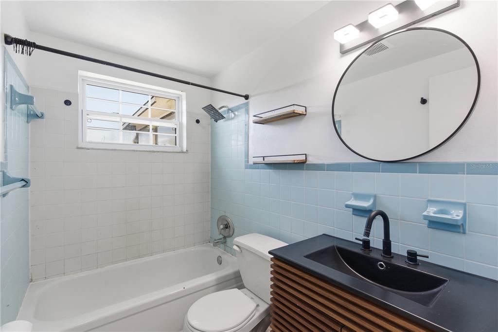 3922 Darlington Road Holiday, FL 34691 - Photo 11 of 30 a bathroom with a sink a toilet and bathtub