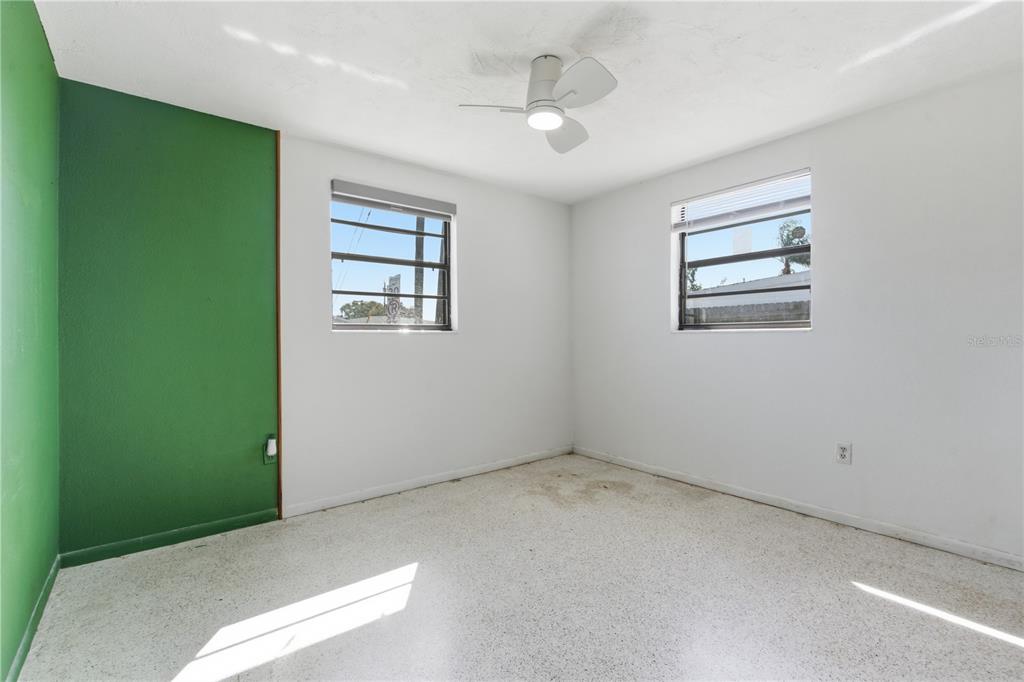 3922 Darlington Road Holiday, FL 34691 - Photo 13 of 30 an empty room with windows and closet