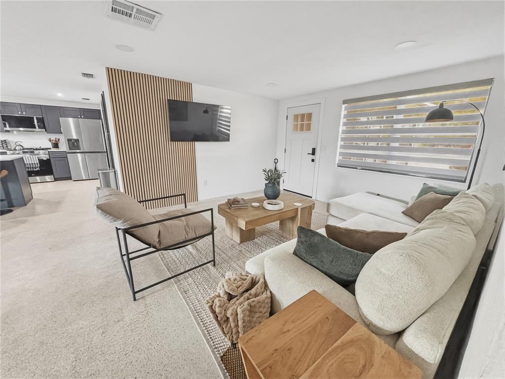 3922 Darlington Road Holiday, FL 34691 - Photo 2 of 30 a living room with furniture and a flat screen tv