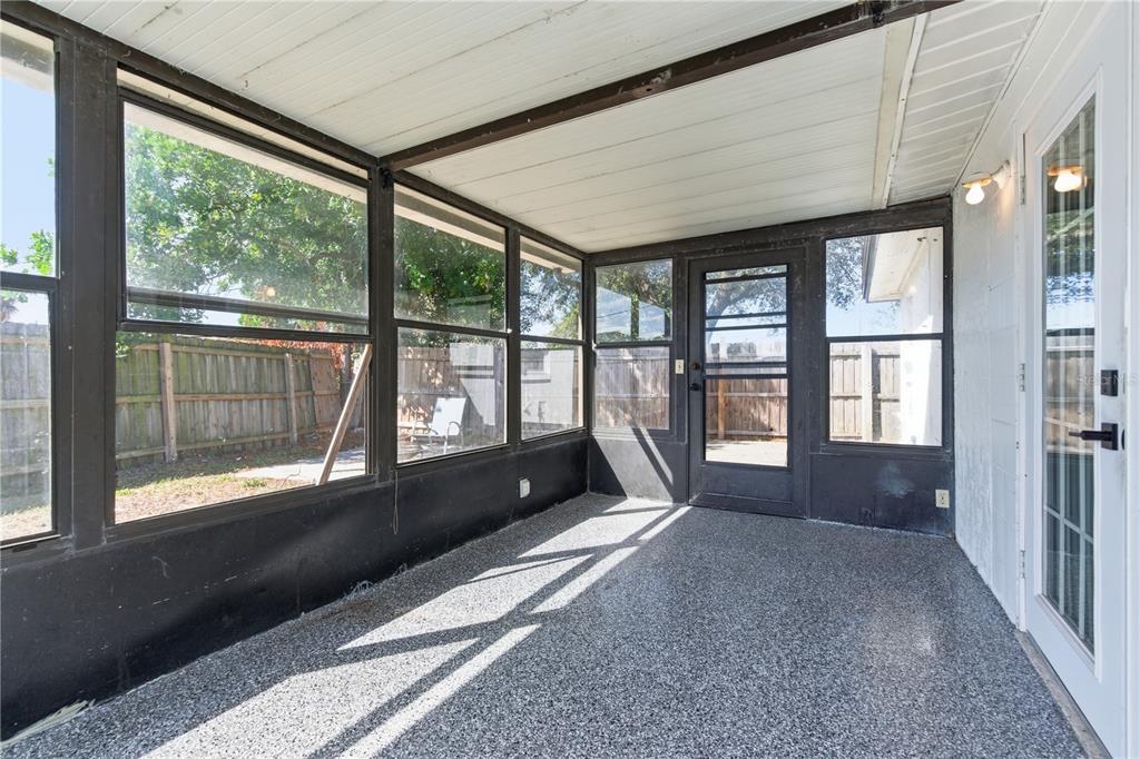 3922 Darlington Road Holiday, FL 34691 - Photo 21 of 30 a view of an empty room with wooden floor and a window