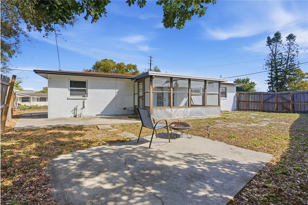 3922 Darlington Road Holiday, FL 34691 - Photo 23 of 30 a view of a house with backyard and a garage