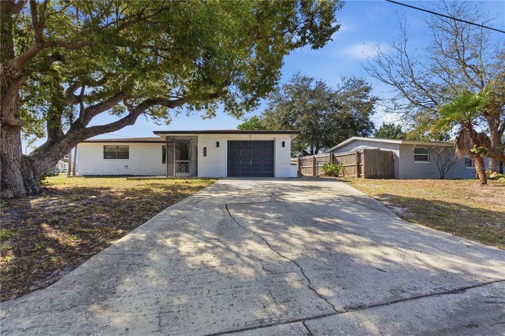 3922 Darlington Road Holiday, FL 34691 - Photo 24 of 30 a front view of house with yard and trees