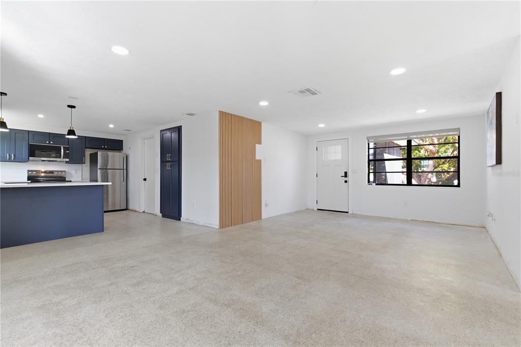 3922 Darlington Road Holiday, FL 34691 - Photo 4 of 30 an empty room with a kitchen and a window