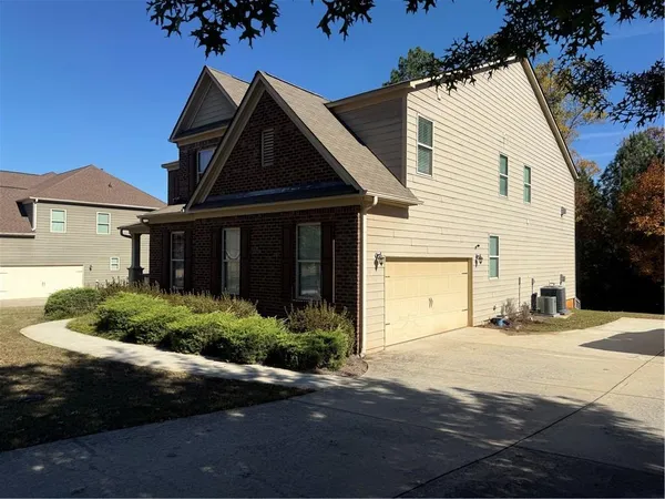 a front view of a house with a yard