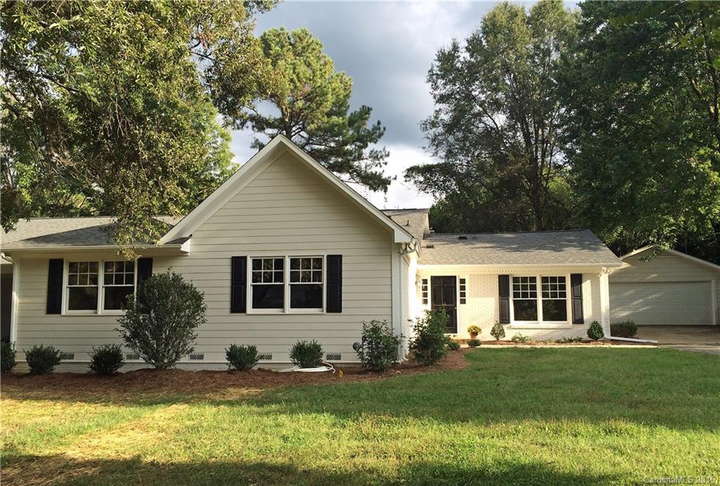 3003 Clarendon Road, Unit A Charlotte, NC 28211 - Photo 1 of 13 a front view of house with yard and green space
