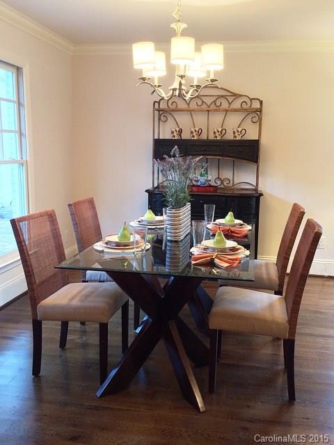 3003 Clarendon Road, Unit A Charlotte, NC 28211 - Photo 4 of 13 a view of a dining room with furniture and wooden floor