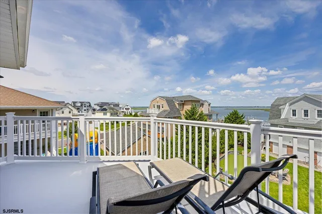 a front view of a residential apartment building with a yard