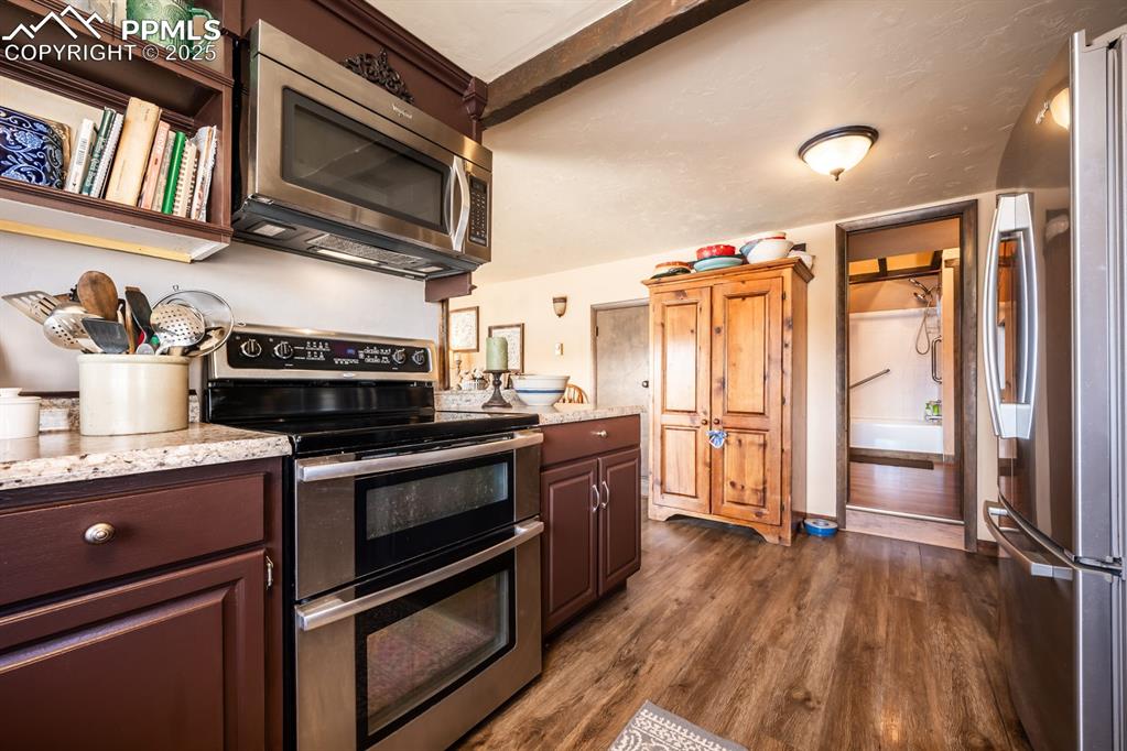 8419 3 R Road Beulah, CO 81023 - Photo 13 of 35 a kitchen with stainless steel appliances granite countertop a stove and a refrigerator