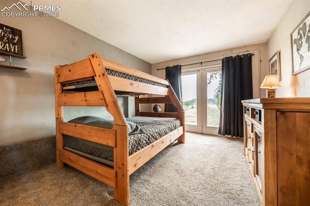 8419 3 R Road Beulah, CO 81023 - Photo 22 of 35 a bedroom with a bed and a window