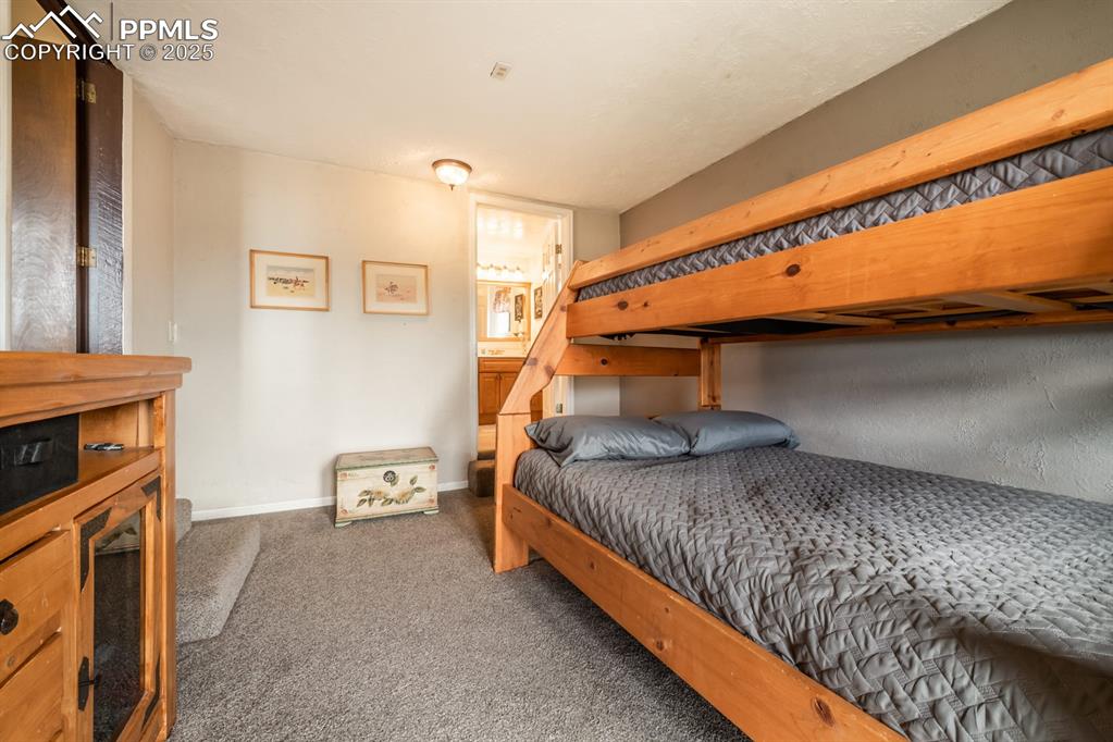 8419 3 R Road Beulah, CO 81023 - Photo 23 of 35 a bedroom with a bed and a tv