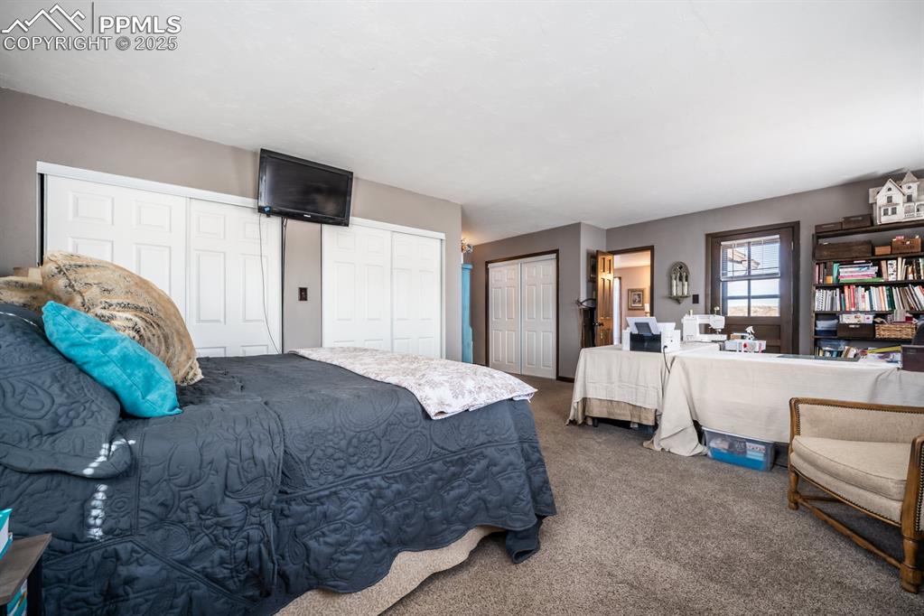 8419 3 R Road Beulah, CO 81023 - Photo 28 of 35 a bed room with a bed and a couch