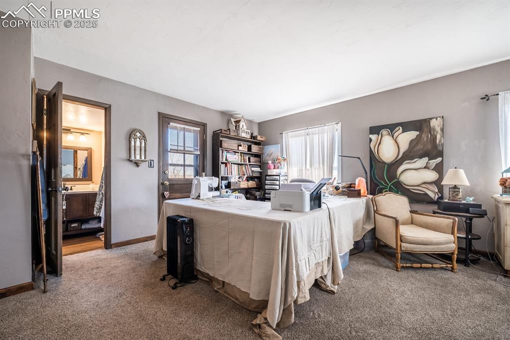8419 3 R Road Beulah, CO 81023 - Photo 29 of 35 a living room with furniture a window and gym equipment