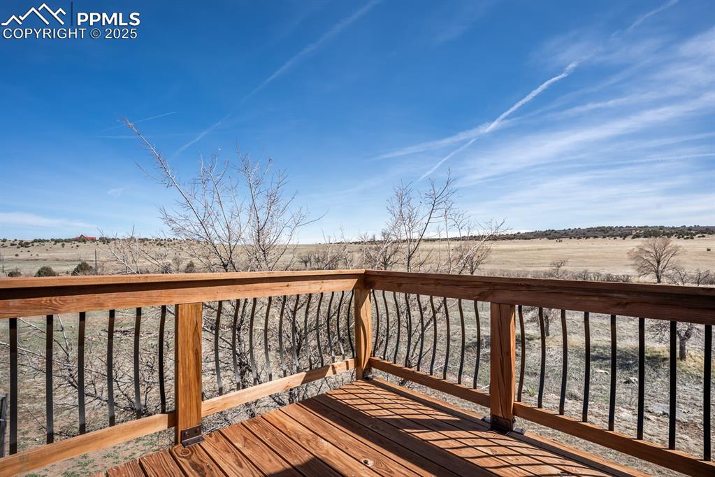 8419 3 R Road Beulah, CO 81023 - Photo 30 of 35 a balcony with wooden floor and fence