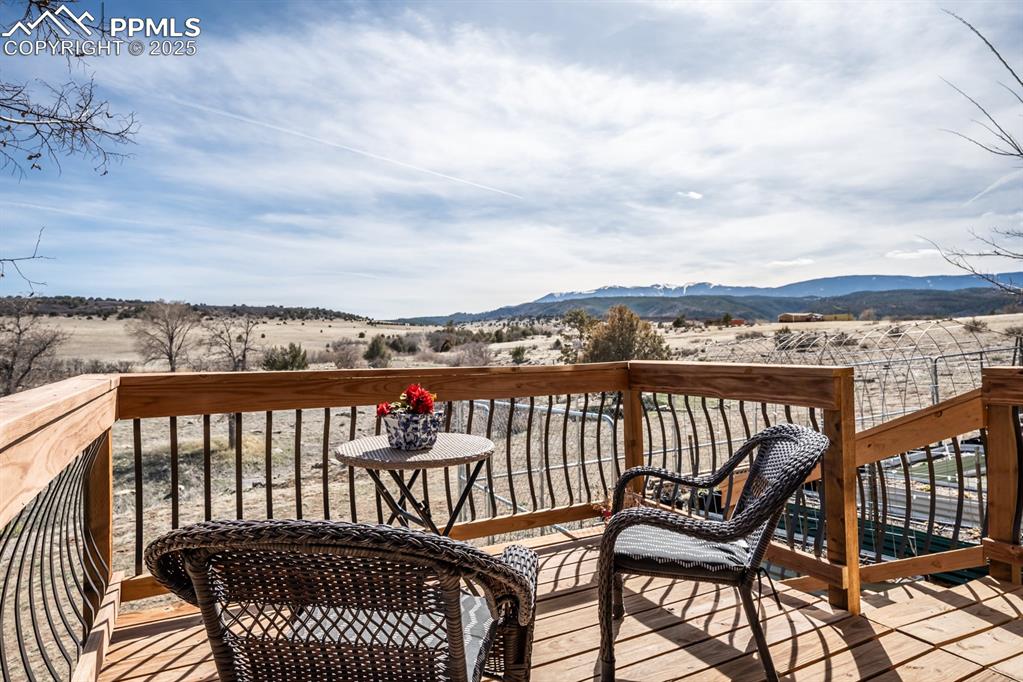 8419 3 R Road Beulah, CO 81023 - Photo 32 of 35 a view of a balcony with wooden chairs