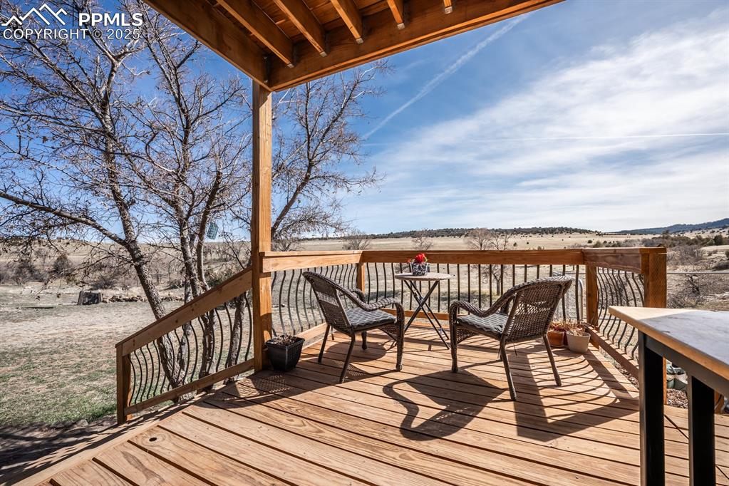 8419 3 R Road Beulah, CO 81023 - Photo 33 of 35 a view of a roof deck with wooden floor and fence