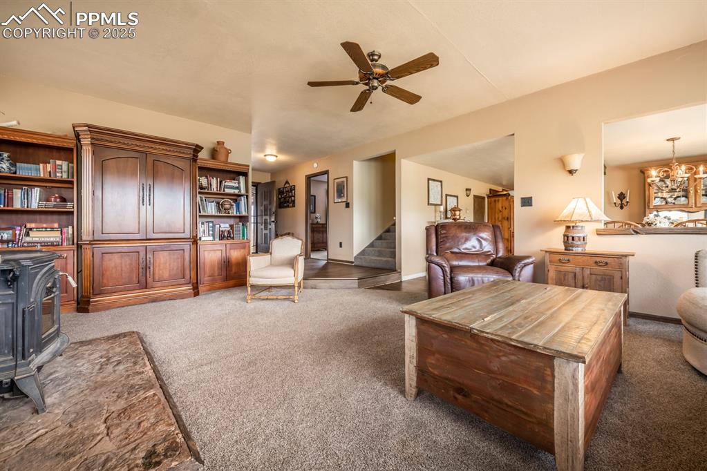8419 3 R Road Beulah, CO 81023 - Photo 5 of 35 a living room with furniture a ceiling fan and a rug