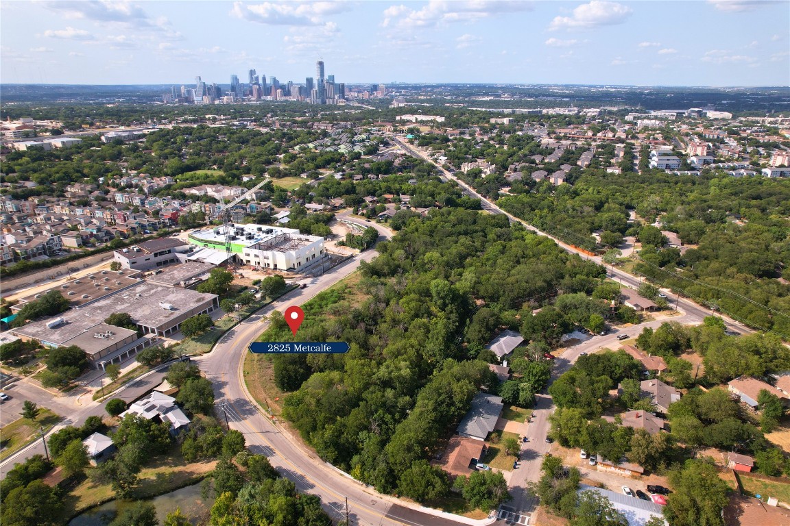 2825 Metcalfe Road Austin, TX 78741 - Photo 1 of 6 an aerial view of residential houses with outdoor space and trees