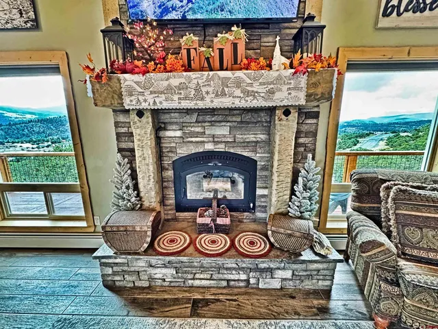a table with chairs and a fireplace