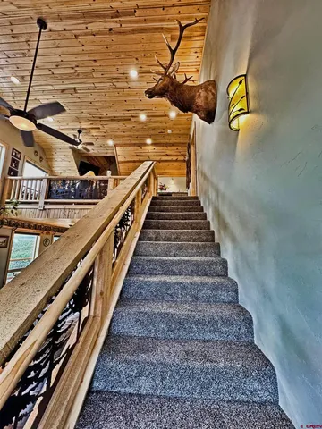 a bedroom with furniture and a large window