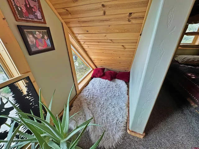 a bathroom with sink toilet and window