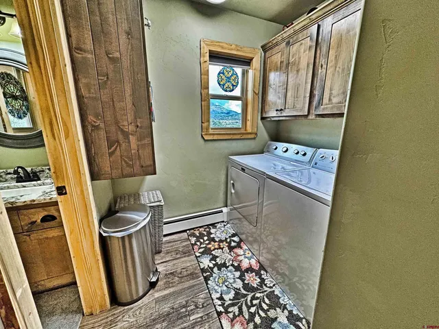 a view of a balcony with wooden floor and outdoor seating