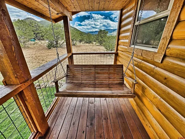 a view of a chairs and table in the patio