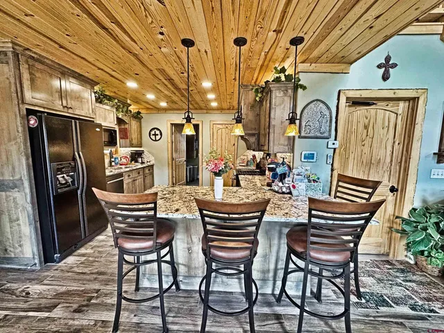 a dining room with furniture and a chandelier
