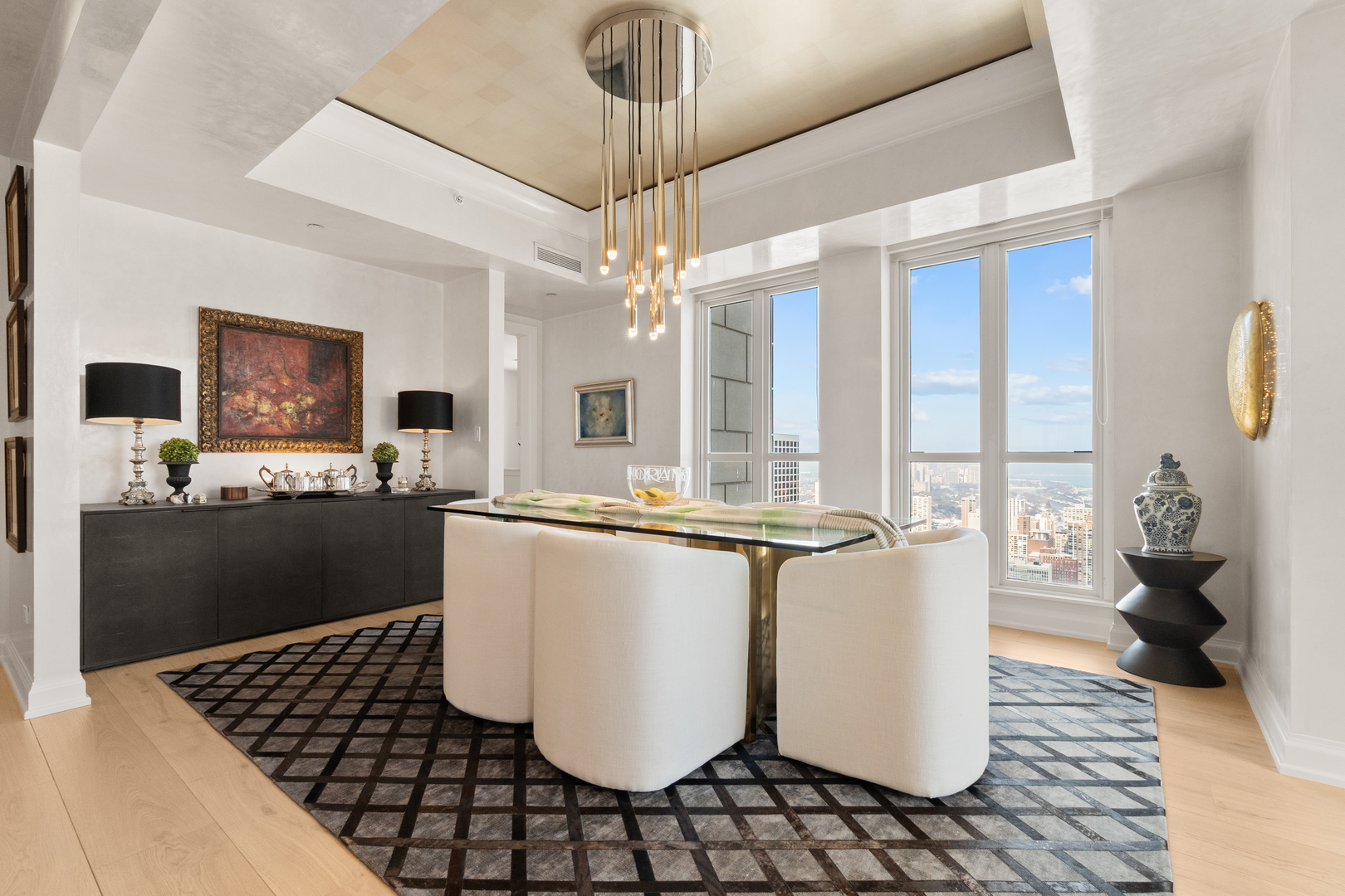 11 East Walton Street, Unit 4802 Chicago, IL 60611 - Photo 12 of 47 a room with table and chairs