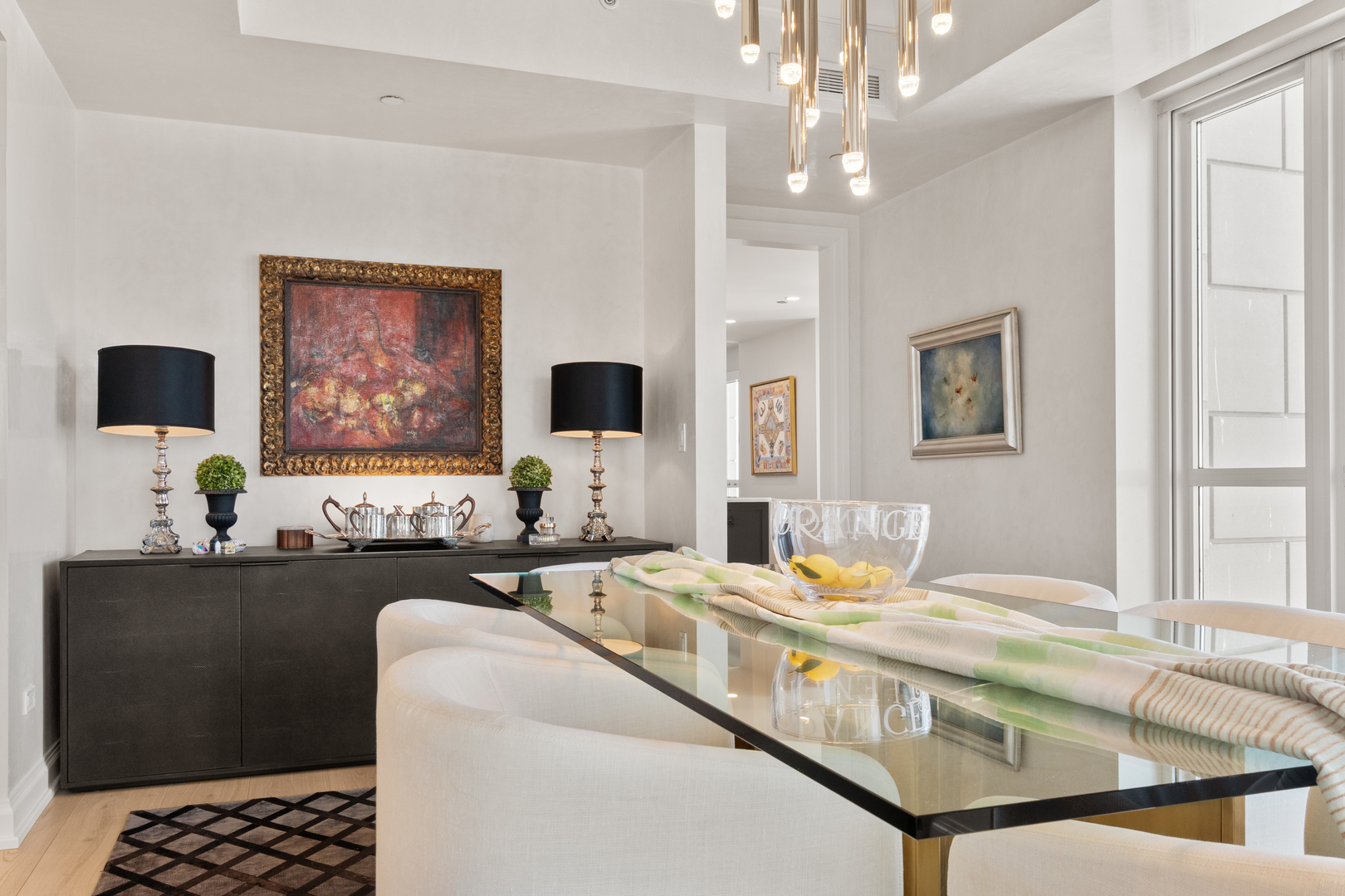 11 East Walton Street, Unit 4802 Chicago, IL 60611 - Photo 13 of 47 a living room with furniture and flat screen tv