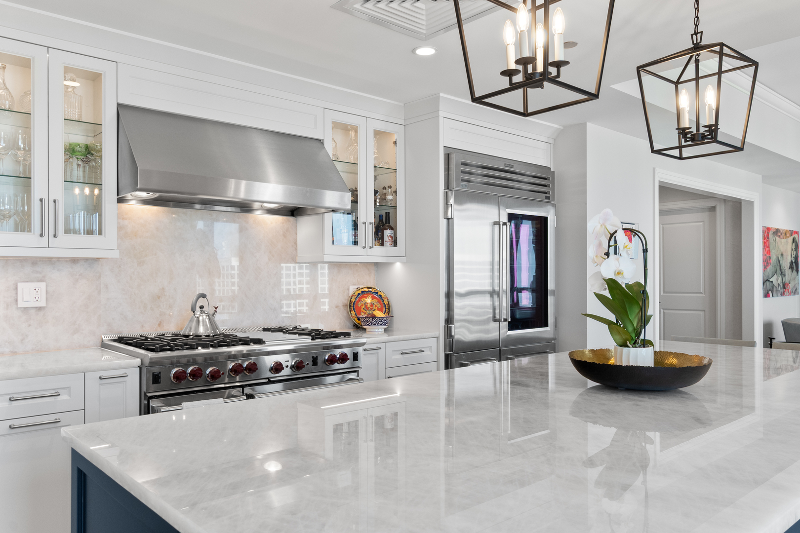 11 East Walton Street, Unit 4802 Chicago, IL 60611 - Photo 16 of 47 a kitchen with stainless steel appliances granite countertop a sink a stove and a wooden floors
