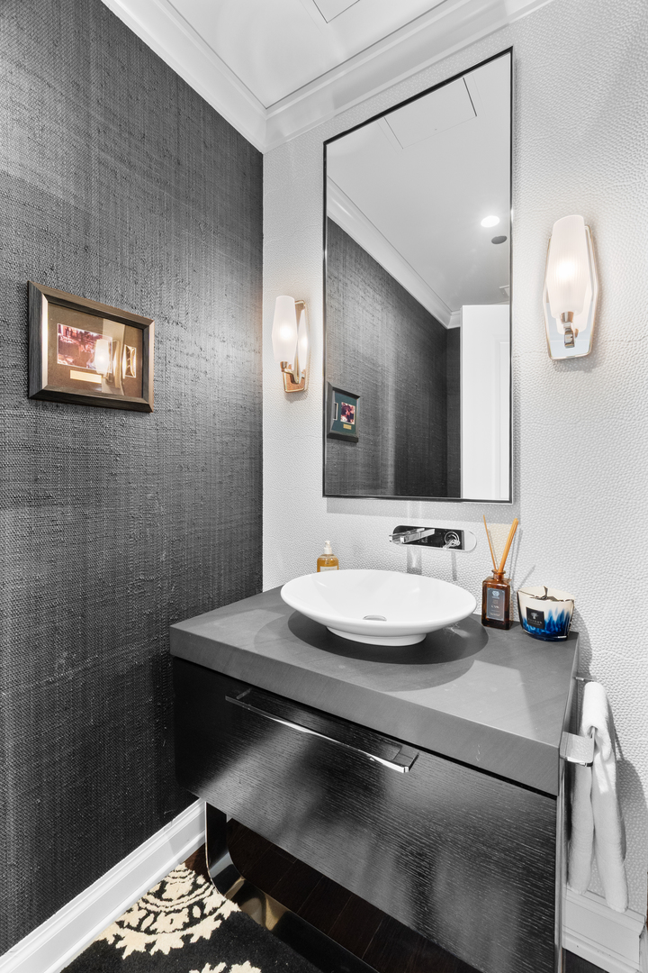 11 East Walton Street, Unit 4802 Chicago, IL 60611 - Photo 25 of 47 a bathroom with a sink and a mirror