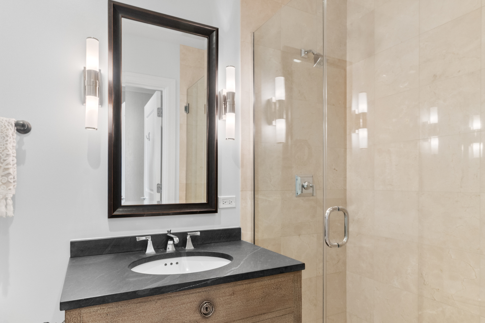 11 East Walton Street, Unit 4802 Chicago, IL 60611 - Photo 38 of 47 a bathroom with a sink and a mirror