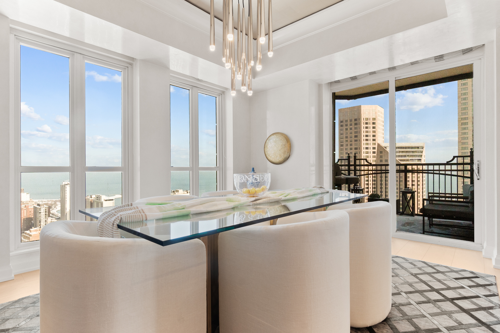 11 East Walton Street, Unit 4802 Chicago, IL 60611 - Photo 10 of 47 a dining table painted next to a window