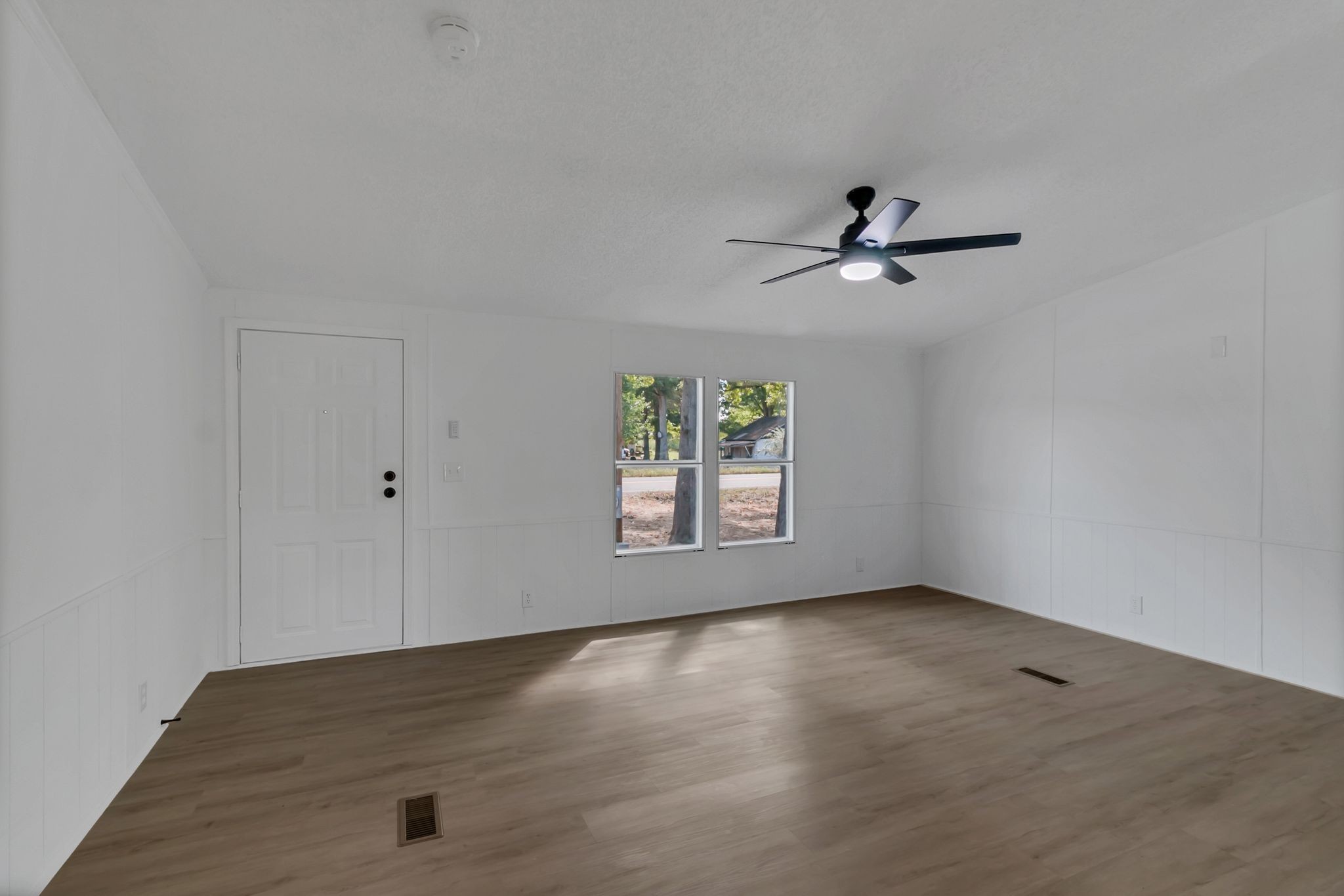 326 Highway 232 Dover, TN 37058 - Photo 12 of 38 an empty room with a window and a ceiling fan