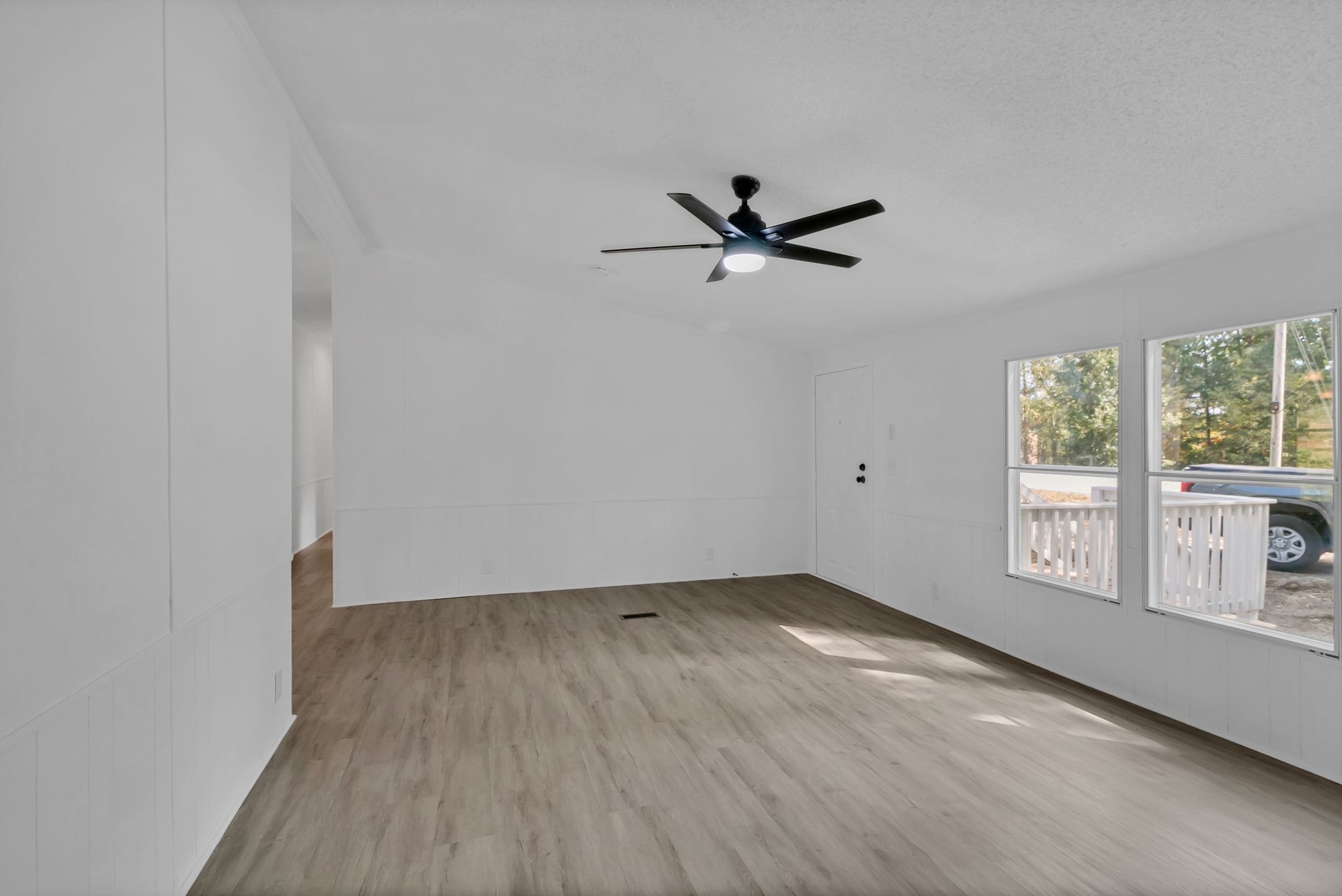 326 Highway 232 Dover, TN 37058 - Photo 13 of 38 an empty room with wooden floor and windows