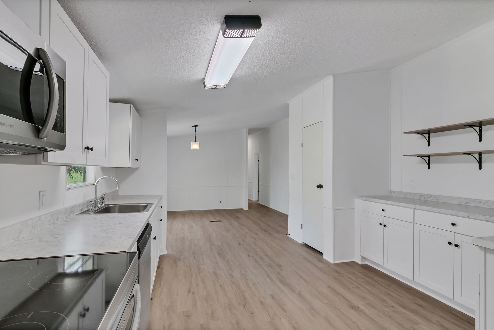 326 Highway 232 Dover, TN 37058 - Photo 15 of 38 a kitchen with granite countertop a sink stainless steel appliances and cabinets