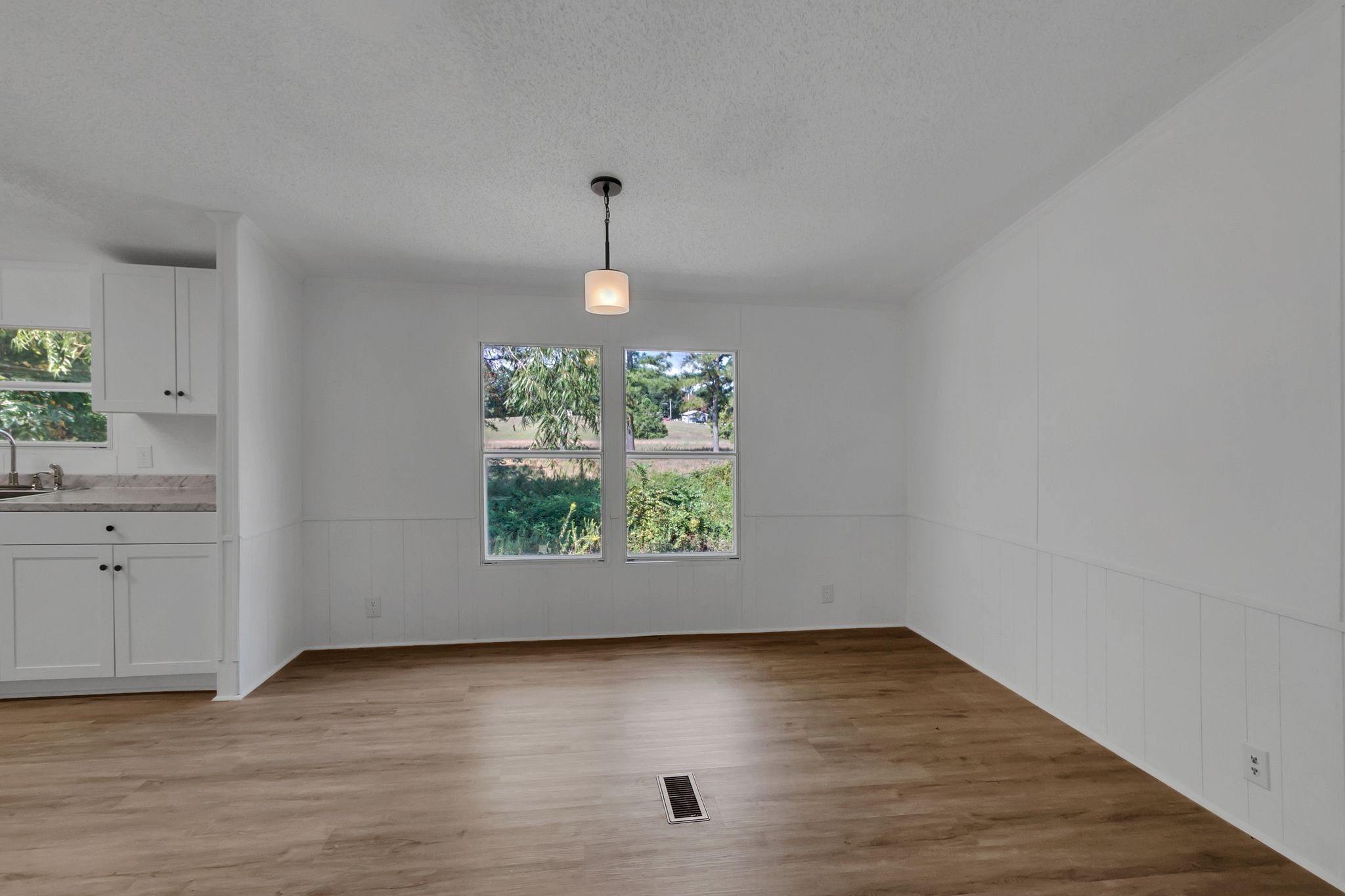 326 Highway 232 Dover, TN 37058 - Photo 18 of 38 an empty room with wooden floor and window