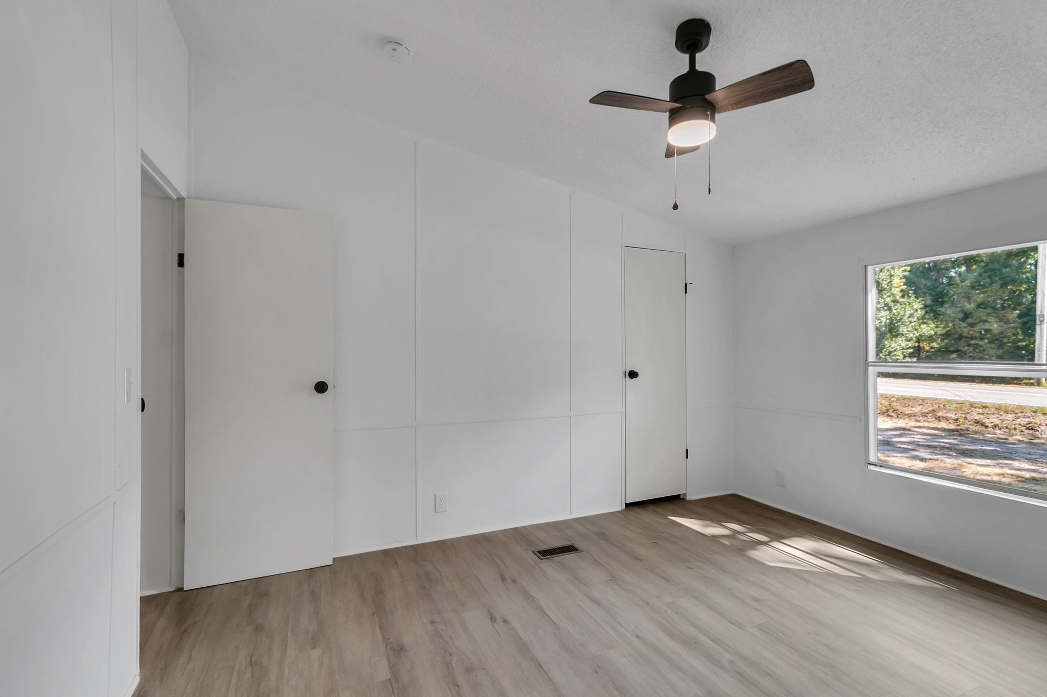 326 Highway 232 Dover, TN 37058 - Photo 22 of 38 wooden floor in an empty room with a window