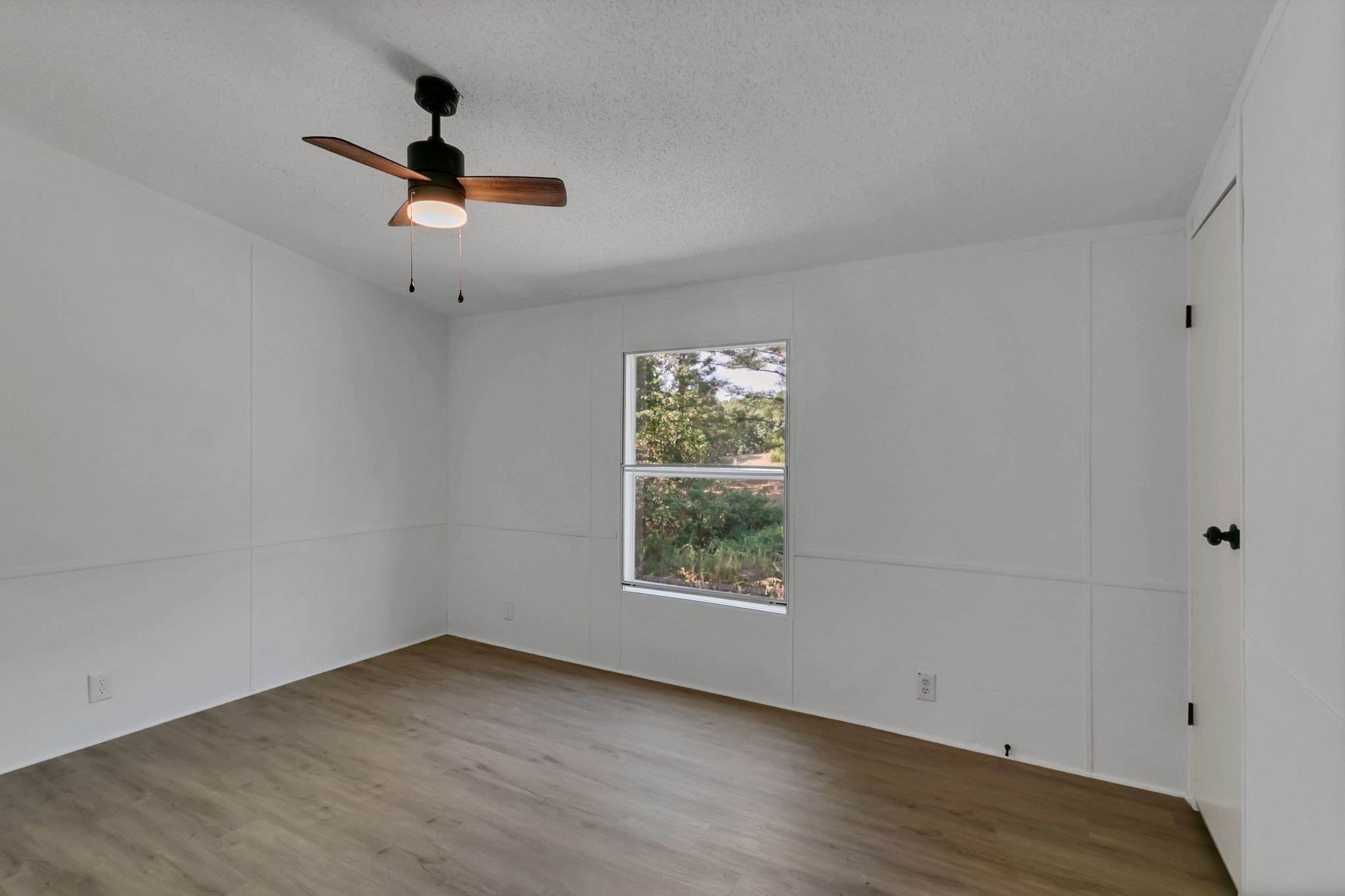 326 Highway 232 Dover, TN 37058 - Photo 24 of 38 a view of an empty room with wooden floor and a window