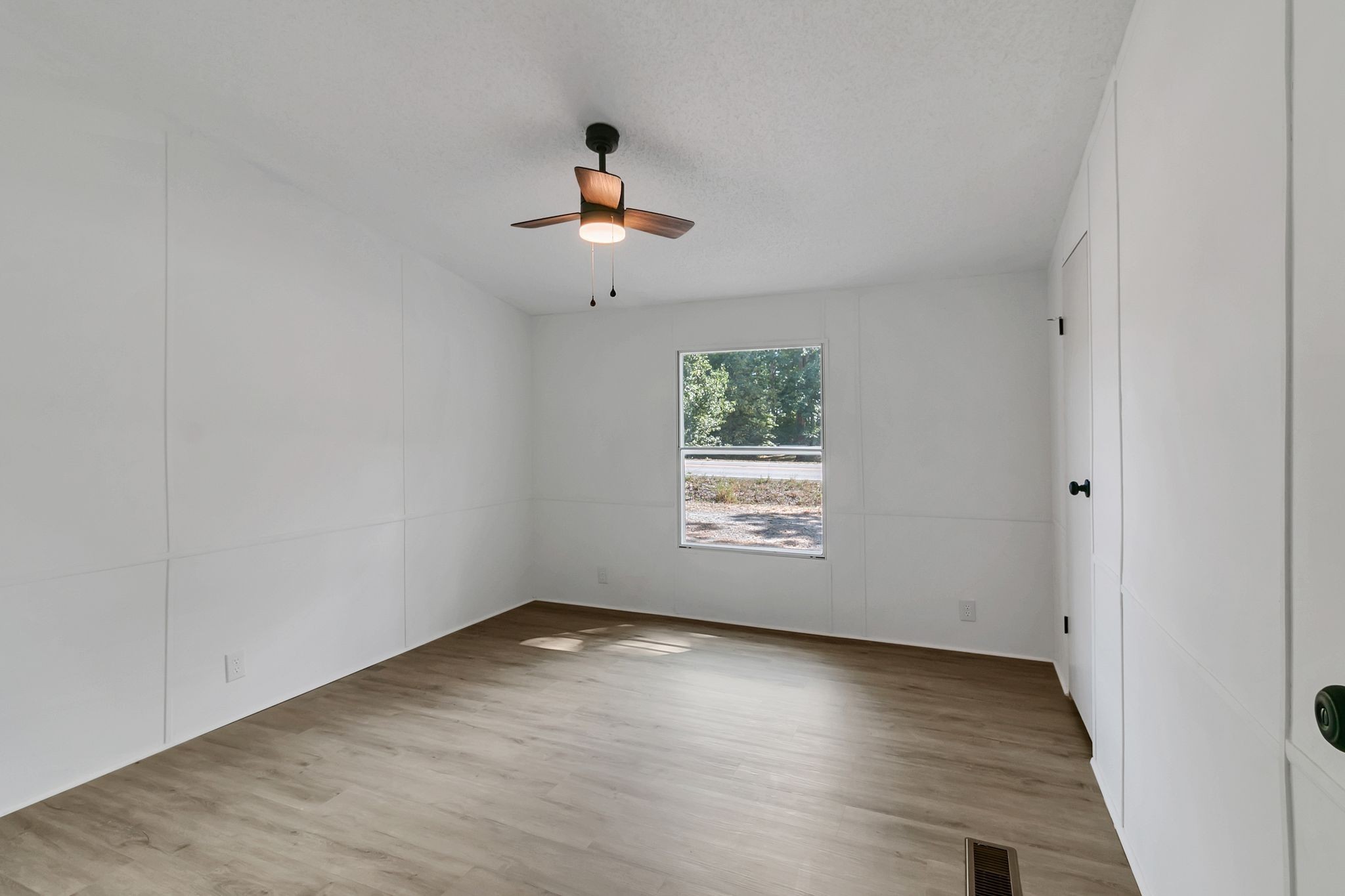 326 Highway 232 Dover, TN 37058 - Photo 27 of 38 an empty room with wooden floor and windows