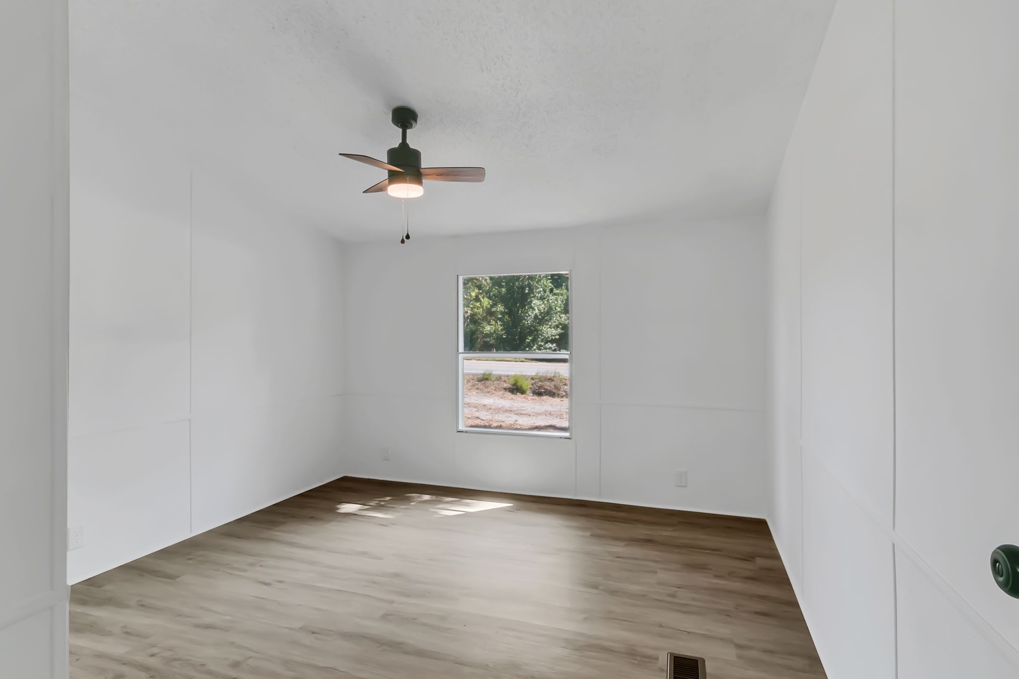 326 Highway 232 Dover, TN 37058 - Photo 31 of 38 an empty room with a window and ceiling fan