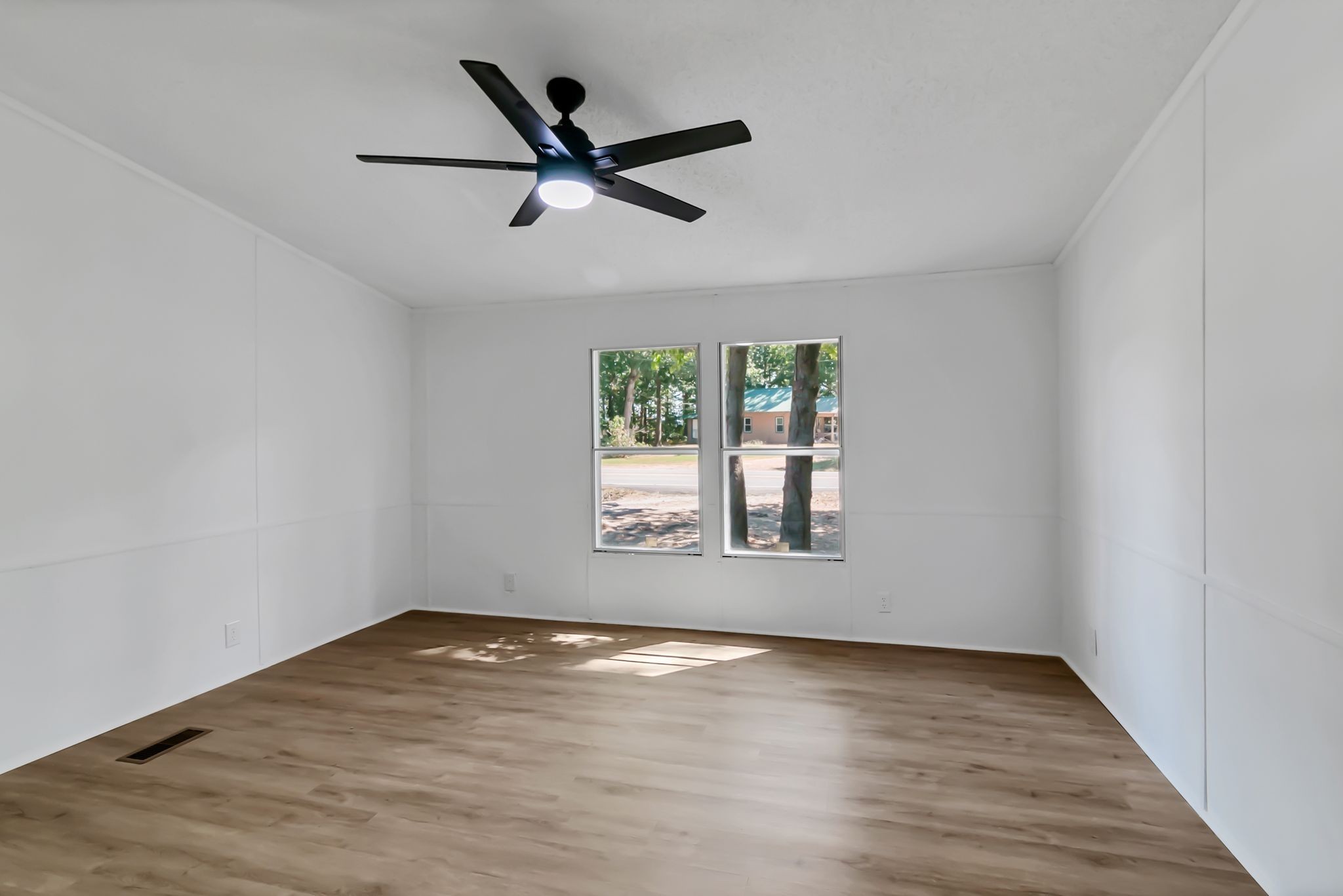 326 Highway 232 Dover, TN 37058 - Photo 33 of 38 an empty room with wooden floor fan and windows