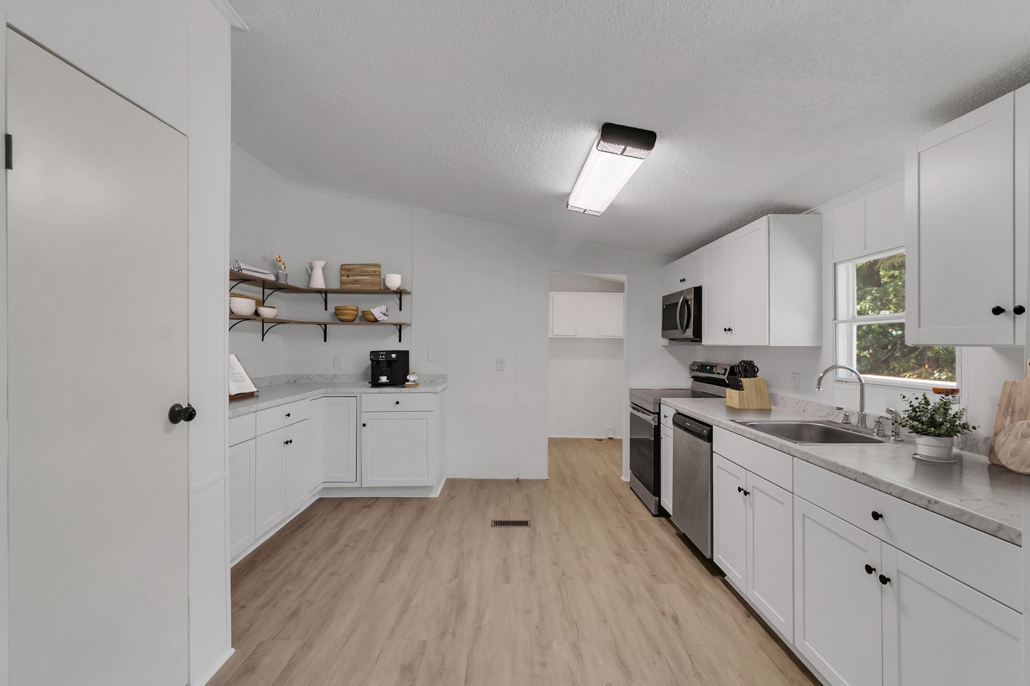 326 Highway 232 Dover, TN 37058 - Photo 8 of 38 a kitchen with cabinets a sink and appliances
