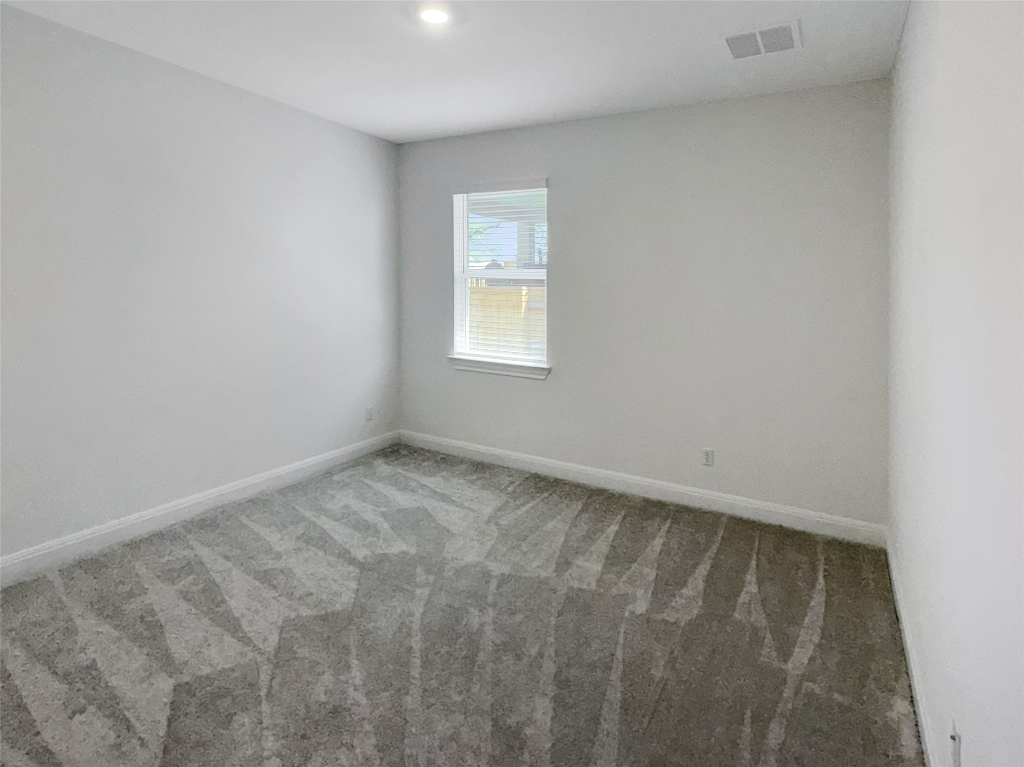 693 Jackson River Loop Kyle, TX 78640 - Photo 31 of 40 an empty room with a window