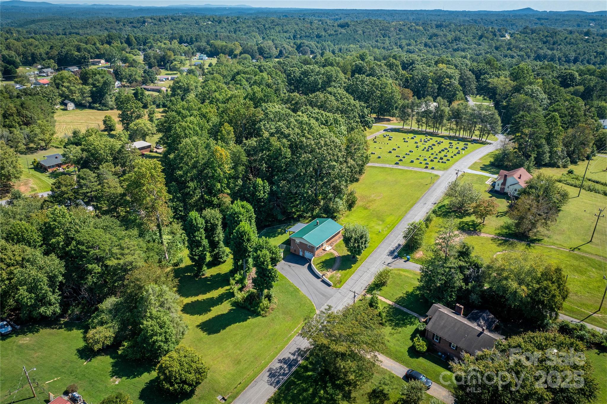 111 Baxter Street Morganton, NC 28655 - Photo 23 of 26 an aerial view of a house with a yard and lake view