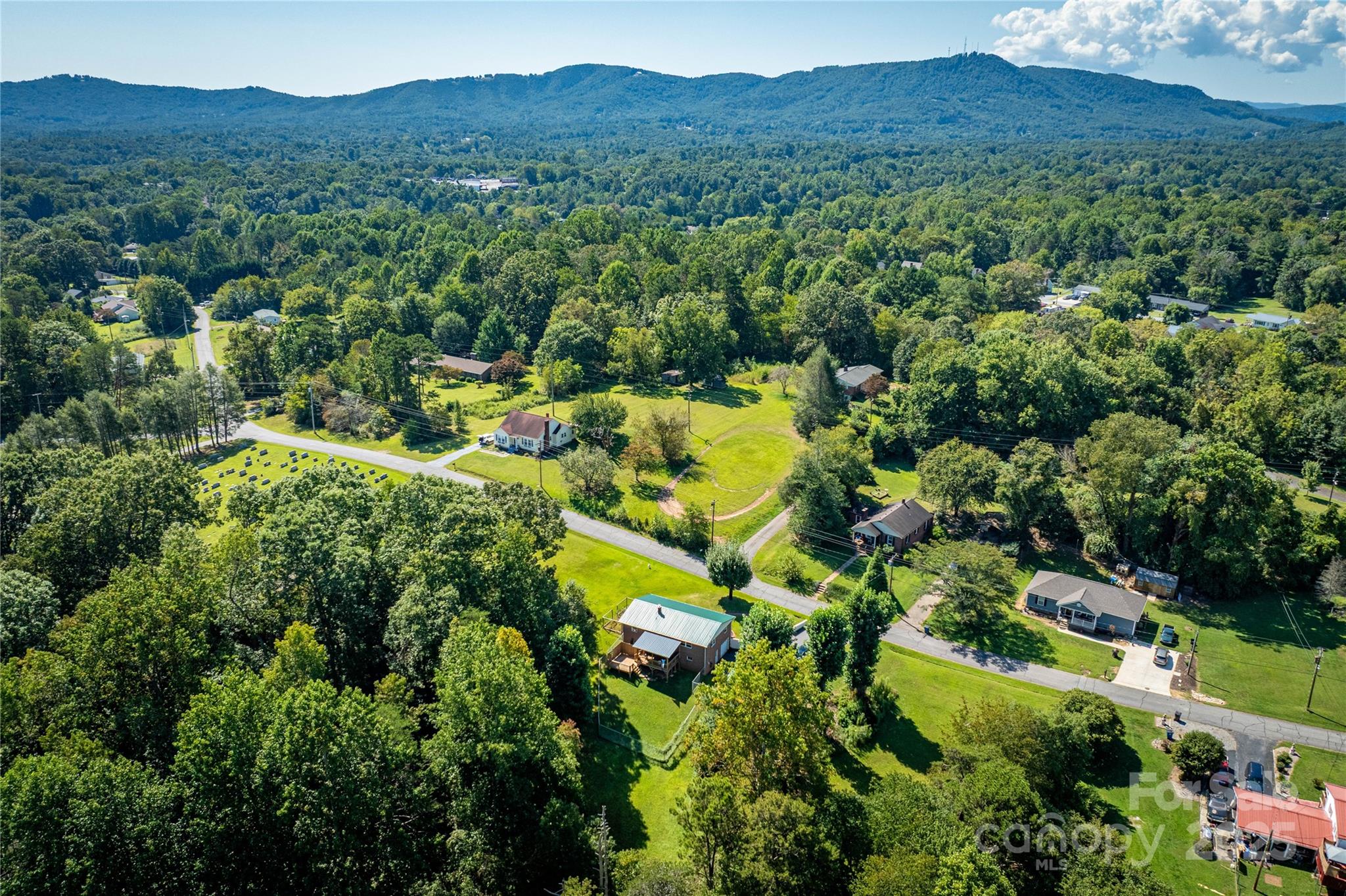 111 Baxter Street Morganton, NC 28655 - Photo 25 of 26 a view of a lush green forest with a house