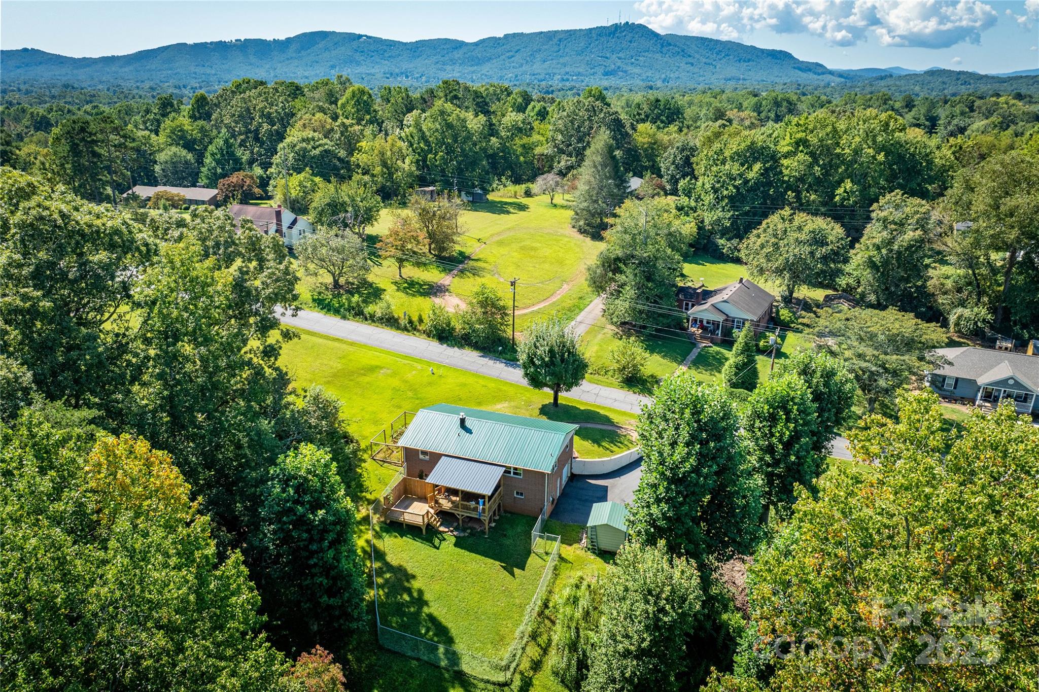 111 Baxter Street Morganton, NC 28655 - Photo 26 of 26 an aerial view of a house with garden space and a lake view